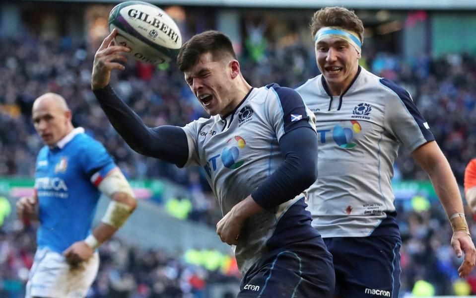 Blair Kinghorn celebrates scoring Scotland's fourth try to complete his hat-trick - ACTION IMAGES