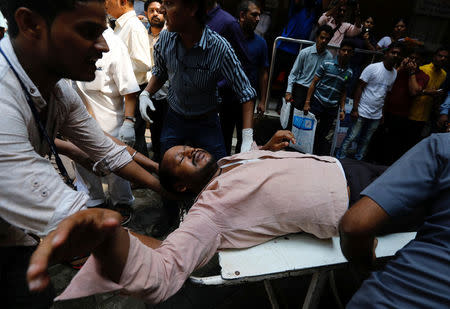 A stampede victim is carried on a stretcher at a hospital in Mumbai, India September 29, 2017. REUTERS/Danish Siddiqui