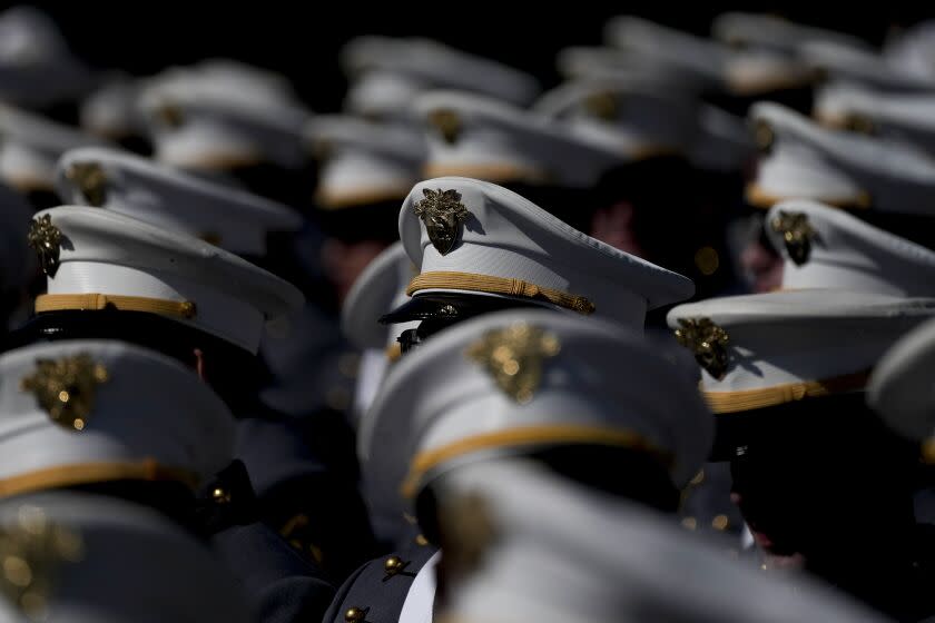 The Sun shines off cadets' hats during the graduation ceremony of the U.S. Military Academy class of 2023 at Michie Stadium on Saturday, May 27, 2023, in West Point, N.Y (AP Photo/Bryan Woolston)