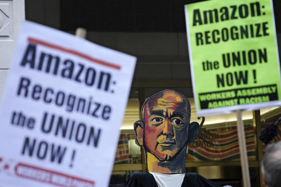 FILE — Activists rally outside while others deliver "Authorization of Representation" forms to the National Labor Relations Board in New York, Oct. 25, 2021. Federal labor officials say Amazon workers have lined up enough support to vote on whether to unionize a New York City warehouse. The National Labor Relations Board confirmed Thursday, Jan. 27, 2022 that the nascent Amazon Labor Union gathered enough signatures to hold an election. (AP Photo/Seth Wenig, File)