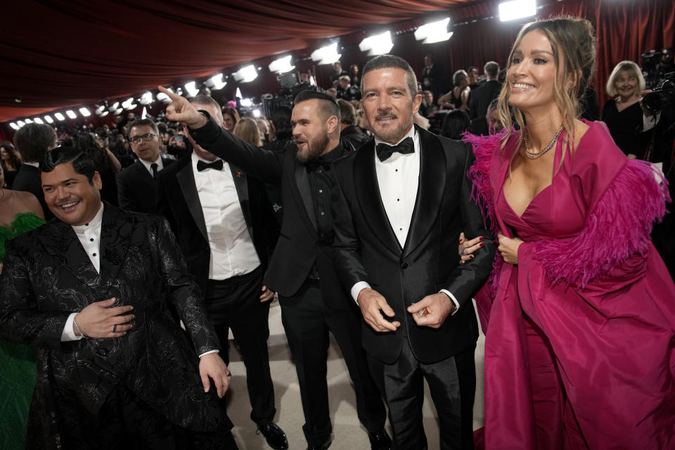 Antonio Banderas, left, and Nicole Kimpel arrive at the Oscars on Sunday, March 12, 2023, at the Dolby Theatre in Los Angeles. (AP Photo/John Locher)