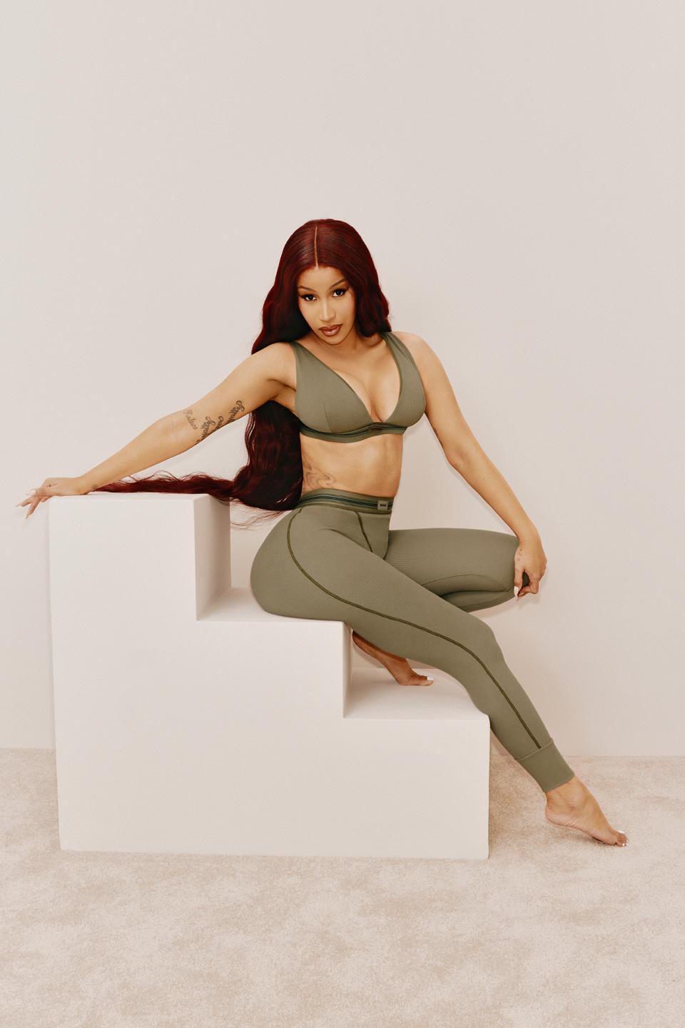 Cardi B in the Skims campaign wearing the Skims cotton rib plunge bralette ($36) and the cotton rib legging ($54) from the brand’s cotton collection.