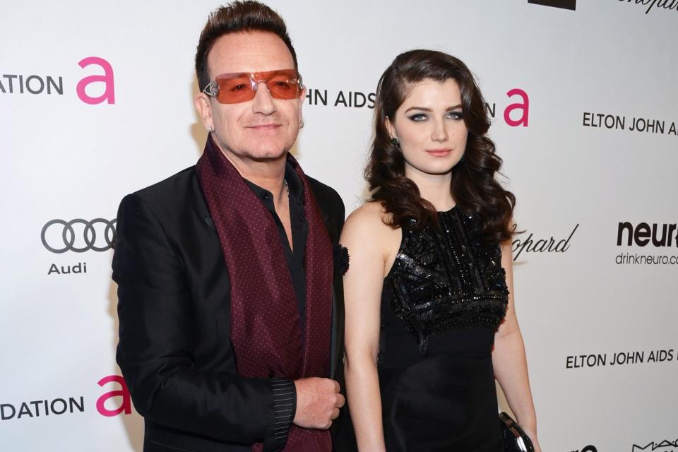 WEST HOLLYWOOD, CA - FEBRUARY 24: Musician Bono (L) and actress Eve Hewson attend the 21st Annual Elton John AIDS Foundation Academy Awards Viewing Party at West Hollywood Park on February 24, 2013 in West Hollywood, California. (Photo by Jason Kempin/Getty Images for EJAF)