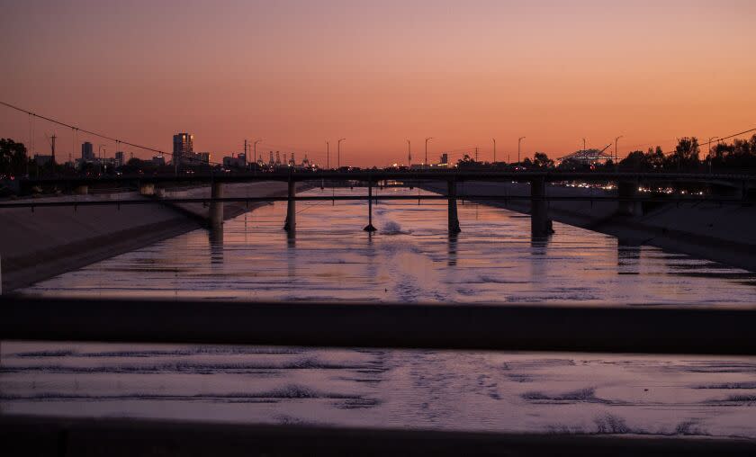 Long Beach CA - December 16: A view of the Los Angeles River at dusk after a storm in Long Beach, CA on Thursday, Dec. 16, 2021. (Allen J. Schaben / Los Angeles Times)