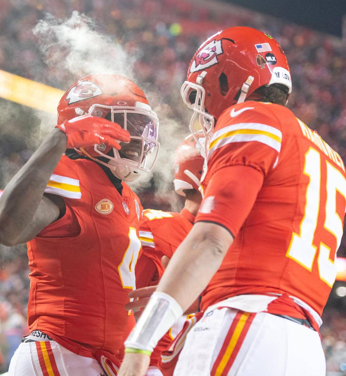 Kansas City Chiefs wide receiver Rashee Rice (4) celebrates a touchdown reception with quarterback Patrick Mahomes (15) during an AFC Wild Card game against the Miami Dolphins at GEHA Field at Arrowhead Stadium on Saturday, Jan. 13, 2024, in Kansas City.