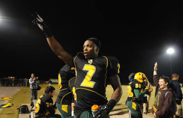 Derrick Henry acknowledges the crowd after setting the national career high school rushing record — Associated Press