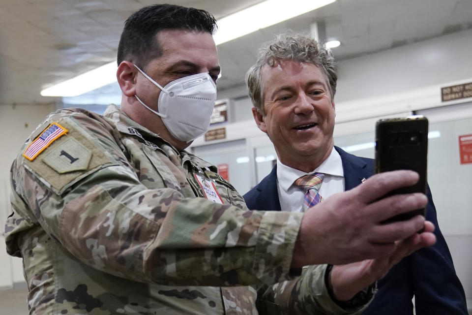 Sen. Rand Paul, R-Ky., poses for a photo with Vincent Scalise of the New York National Guard on Capitol Hill in Washington, Friday, Feb. 12, 2021, on the fourth day of the second impeachment trial of former President Donald Trump. (AP Photo/Susan Walsh)