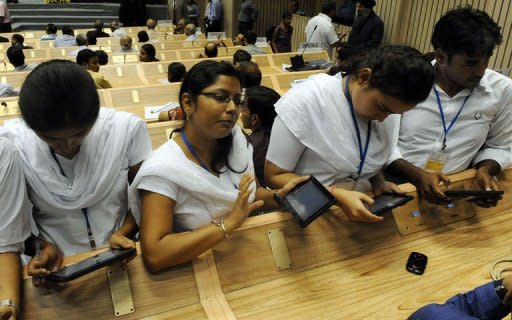 Indian students use the newly launched "Akash" the 46 USD (34 euros) computer tablet in New Delhi. India launched its long-awaited "computer for the masses", unveiling a 46 USD tablet device designed to bring the information technology revolution to tens of millions of students