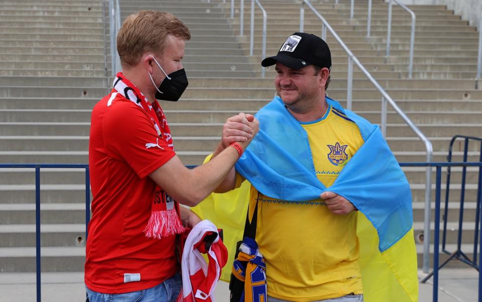 Ukraine and Austria fans outside the stadium in Bucharest before the match - REUTERS/Marko Djurica 
