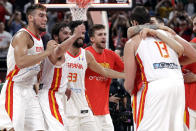 Members of Spain's team celebrate after winning their semifinal match against Australia in double overtime in the FIBA Basketball World Cup at the Cadillac Arena in Beijing, Friday, Sept. 13, 2019. (AP Photo/Mark Schiefelbein)