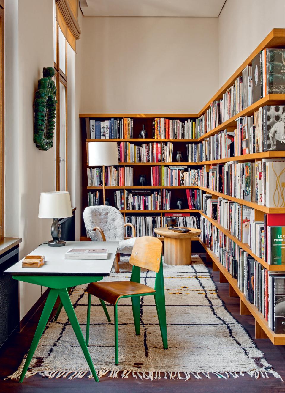 The bold, neon green cover—as seen on the end of this case—perfectly matches the eclectic furniture in the home of the art curator and collector Emmanuel de Bayser.