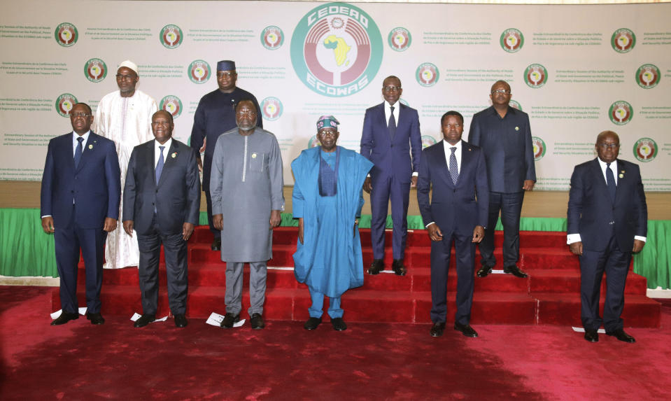 Nigeria's President, Bola Ahmed Tinubu, third from left, first row, poses for a group photo with other West African leaders, prior to the start of the ECOWAS meeting, in Abuja, Nigeria, Saturday, Feb. 24, 2024. Heads of state across West Africa were met on Saturday to discuss the region's existential challenges with a renewed plea on junta-led nations to rescind their decision to quit the regional bloc and a plan to review of sanctions it imposed to reverse the coup in Niger. (AP Photo/Gbemiga Olamikan)