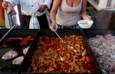 Roma cook stew at a foodstall near the chapel and sacred spring during a pilgrimage in Csatka, Hungary on September 9, 2017. REUTERS/Laszlo Balogh