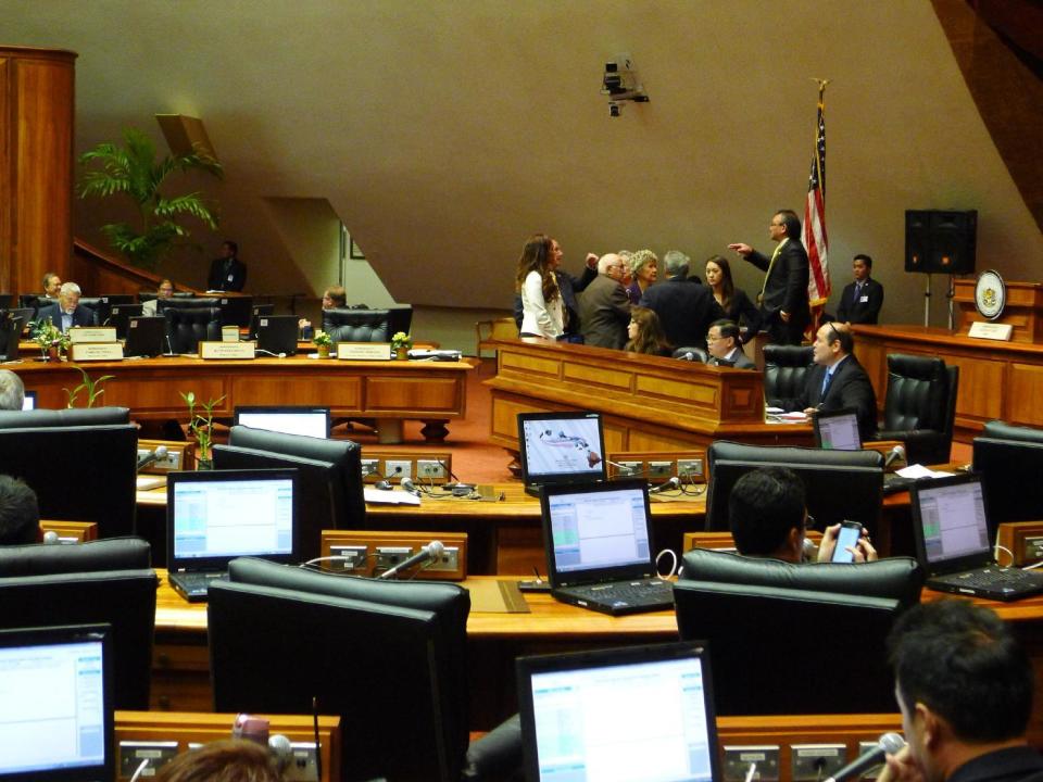 Republican and Democratic leaders in the Hawaii House discussed how to proceed with a vote to remove Rep. Beth Fukumoto from her post as minority leader on Wed., Feb. 1, 2017 in Honolulu. In deep-blue Hawaii, Fukumoto is considering switching parties to become a Democrat after she was pressured to resign her leadership role for criticizing President Donald Trump. (AP Photo/Cathy Bussewitz)