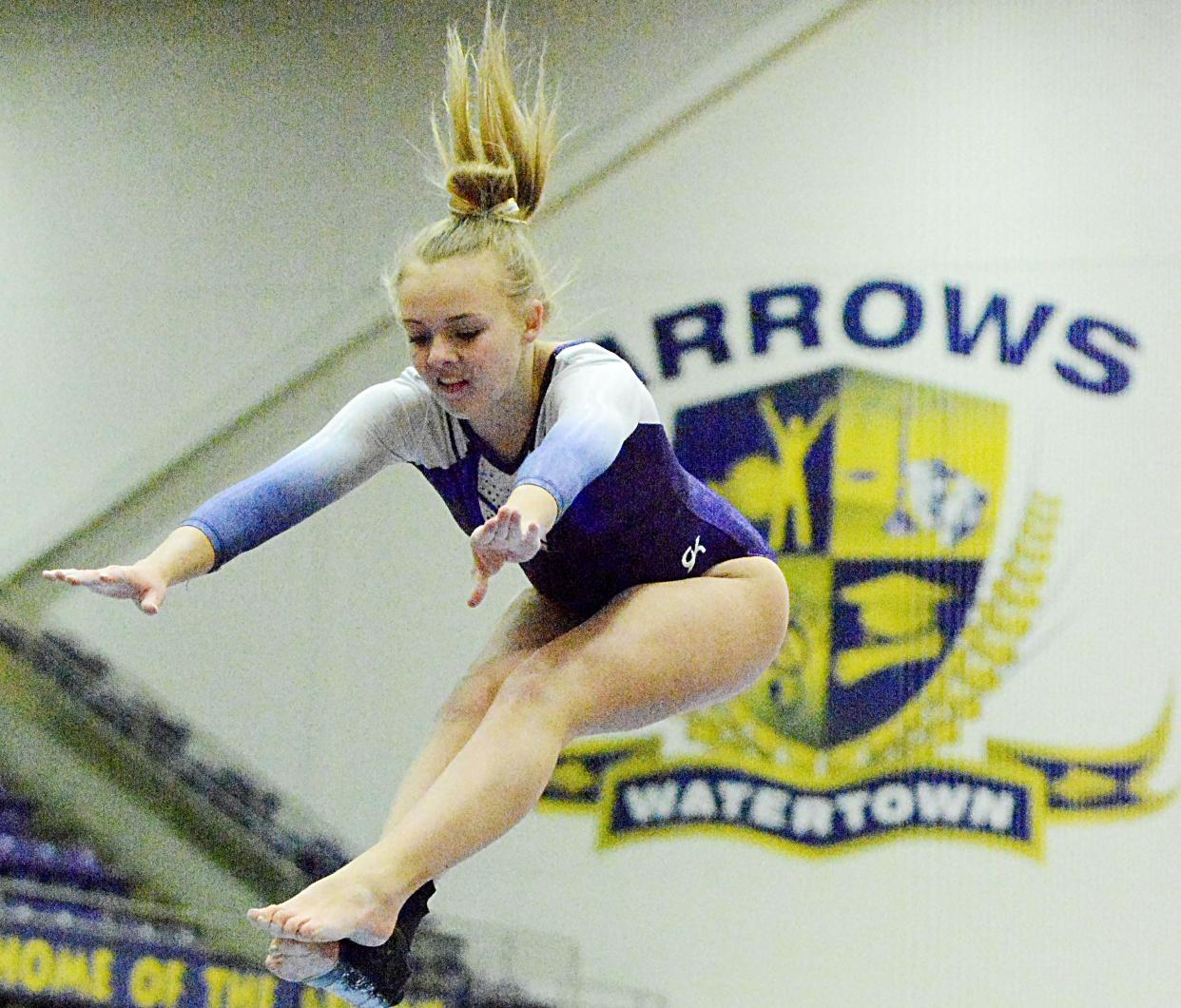 Watertown's Kinsley Van Gilder leaps from the balance beam Thursday during the Watertown Invitational gymnastics meet in the Civic Arena. The Arrows finished second behind Mitchell in the nine-team meet.