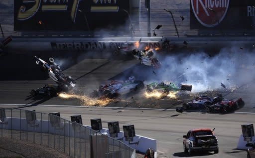 English driver Dan Wheldon was seriously hurt in a massive 15-car crash that sent his and several other cars airborne early in the Las Vegas 300 IndyCar series finale on Sunday