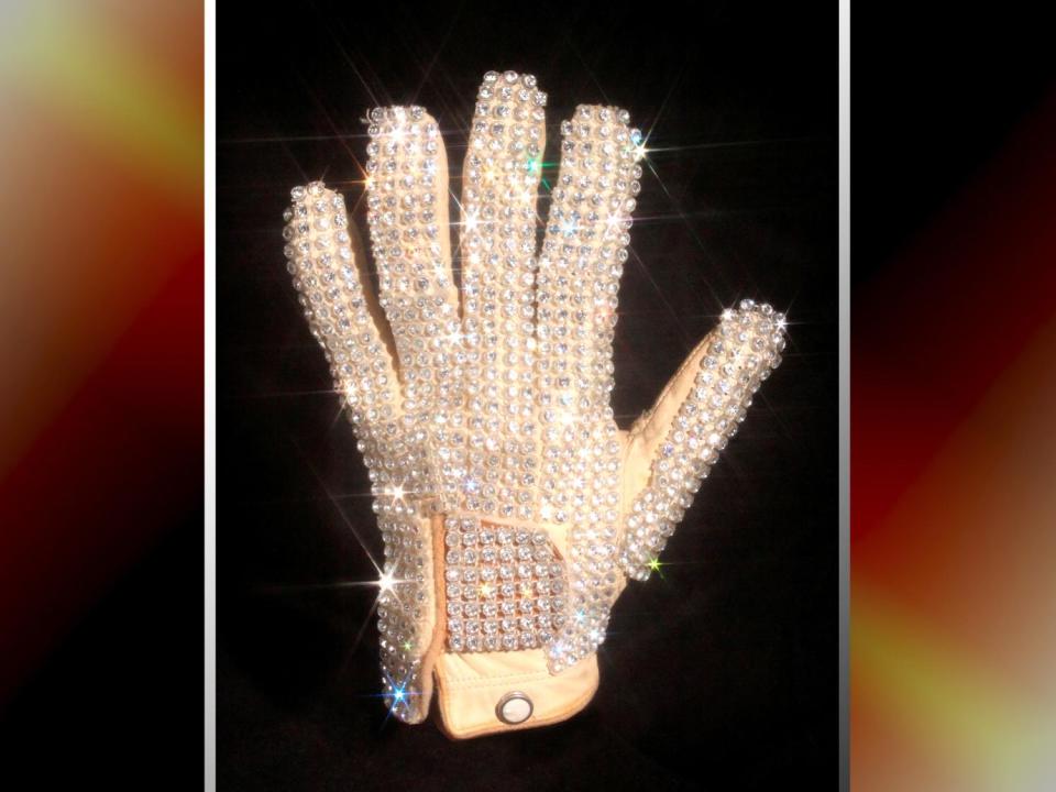 Michael Jackson's glove from his 1983 performance of Billie Jean at the Motown 25 television special where he performed the Moonwalk for the first time, Julien's Auctions handount image on texture, partial graphic