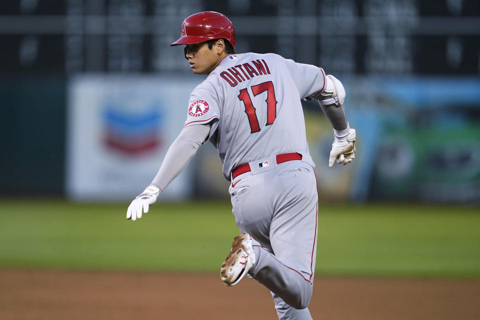 Los Angeles Angels' Shohei Ohtani runs the bases after hitting a two-run home run during the fifth inning of the second baseball game of the team's doubleheader against the Oakland Athletics in Oakland, Calif., Saturday, May 14, 2022. It is Ohtani's 100th homer in the majors. (AP Photo/Jeff Chiu)