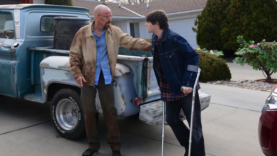 Walter White (left, portrayed by Bryan Cranston) talks with his son, Walter White Jr. (RJ Mitte), in the television drama “Breaking Bad.” - Ursula Coyote/AMC