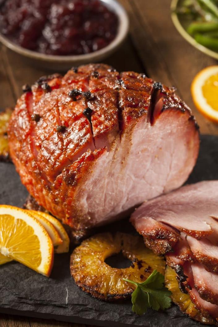 <p>With sweet and earthy flavors, this ham is perfect for holiday dinners.</p><p><strong><a href="https://www.countryliving.com/food-drinks/recipes/a33216/orange-coriander-glazed-ham-recipe/" rel="nofollow noopener" target="_blank" data-ylk="slk:Get the recipe" class="link rapid-noclick-resp">Get the recipe</a>.</strong></p>
