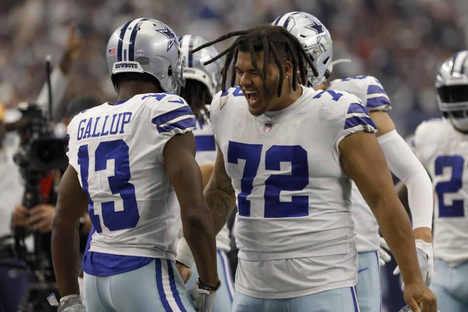 Dallas Cowboys' Michael Gallup (13) and Trysten Hill (72) celebrate after Gallup caught a touchdown pass in the first half of a NFL football game against the Washington Commanders in Arlington, Texas, Sunday, Oct. 2, 2022. (AP Photo/Ron Jenkins)