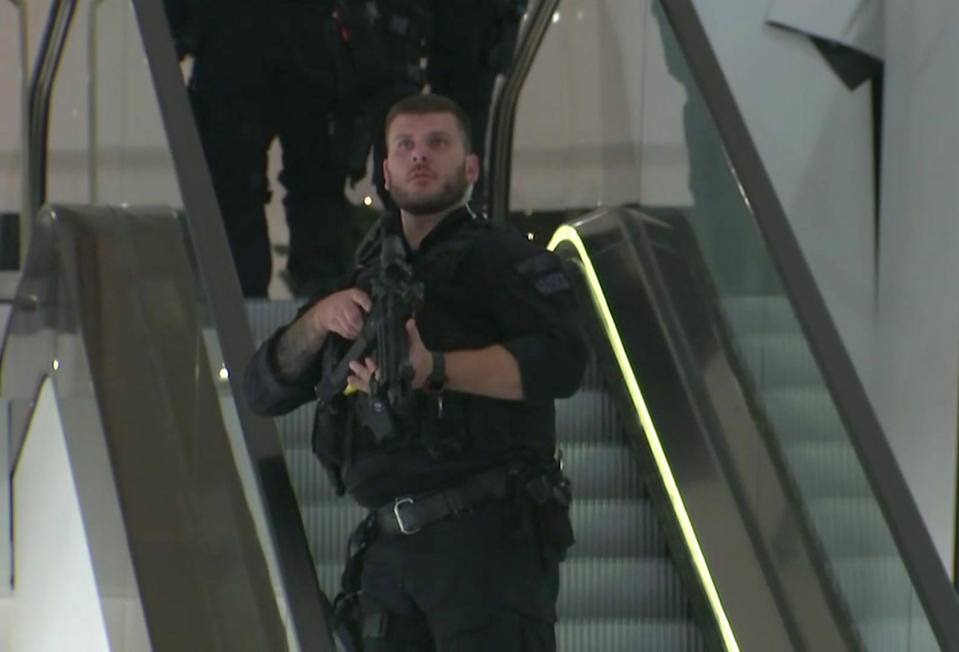 <p>In this grab taken from video, an armed police office patrols a department store, near to Oxford Street, in London, Friday, Nov. 24, 2017. (Photo: AP) </p>