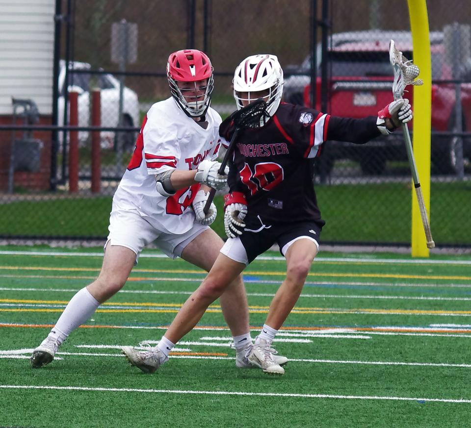 Bridgewater-Raynham's Colin Carfagna jostles with Old Rochester's Andrew Nee during a game on April 11, 2024.