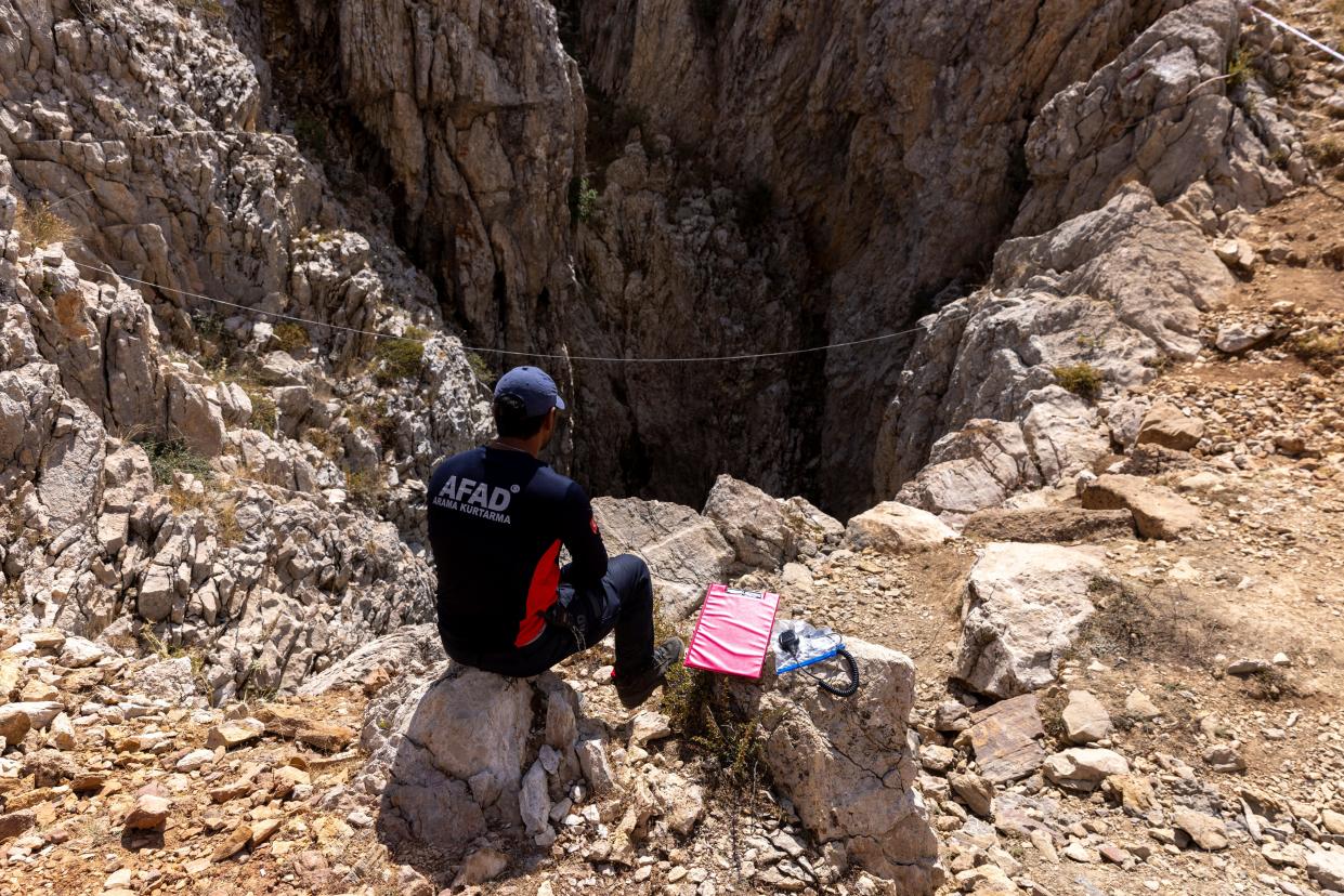 A rescuer is seen at the entrance of Morca Cave, as they take part in a rescue operation to reach U.S. caver Mark Dickey. (REUTERS)