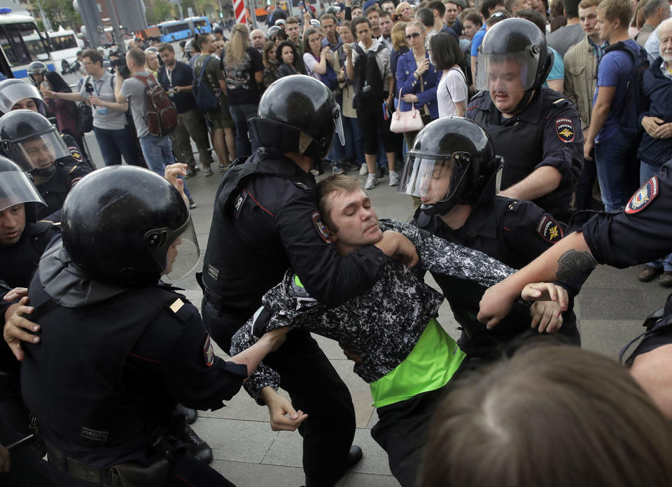 <p>Police detain a protester during a demonstration in downtown Moscow, Russia, Monday, June 12, 2017. (Pavel Golovkin/AP) </p>