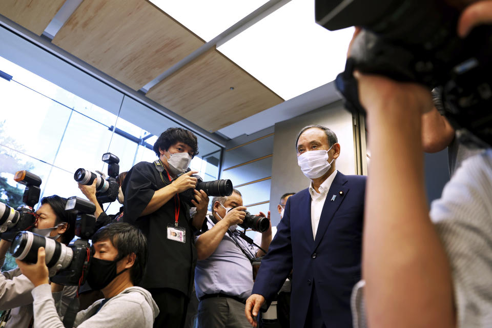 Japanese Primm Minister Yoshihide Suga arrives to meet International Paralympic Committee President Andrew Parsons, in Tokyo Friday, Sept.3, 2021. Suga said Friday he won’t run for leadership of the governing party at the end of this month, paving the way for a new Japanese leader after just a year in office. (Behrouz Mehri/Pool Photo via AP)