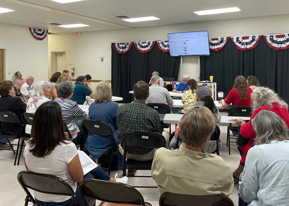 County judges and election workers gather in a full room for the Republican canvass of the primary election.