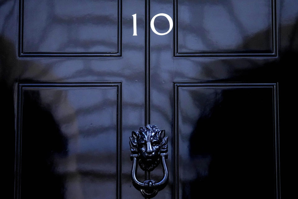 FILE - The door to 10 Downing Street in London, Friday, July 8, 2022. The United Kingdom will hold its first national election in almost five years on Thursday, with opinion polls suggesting that Prime Minister Rishi Sunak's Conservative Party will be punished for failing to deliver on promises made during 14 years in power. (AP Photo/Frank Augstein, File)