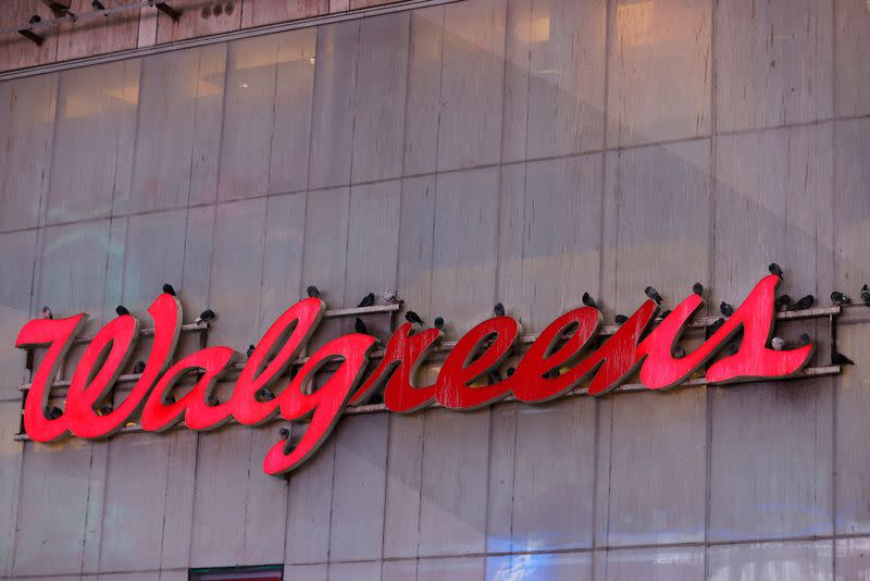FILE PHOTO: Pigeons are seen resting on signage for Walgreens, owned by the Walgreens Boots Alliance, Inc., in Manhattan, New York City