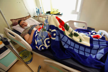 A wounded fighter from Misrata central operation room, who was injured during a truck bomb explosion at Abu Ghrain, lies on a bed inside a hospital in Misrata, Libya May 10, 2016. REUTERS/Ismail Zitouny