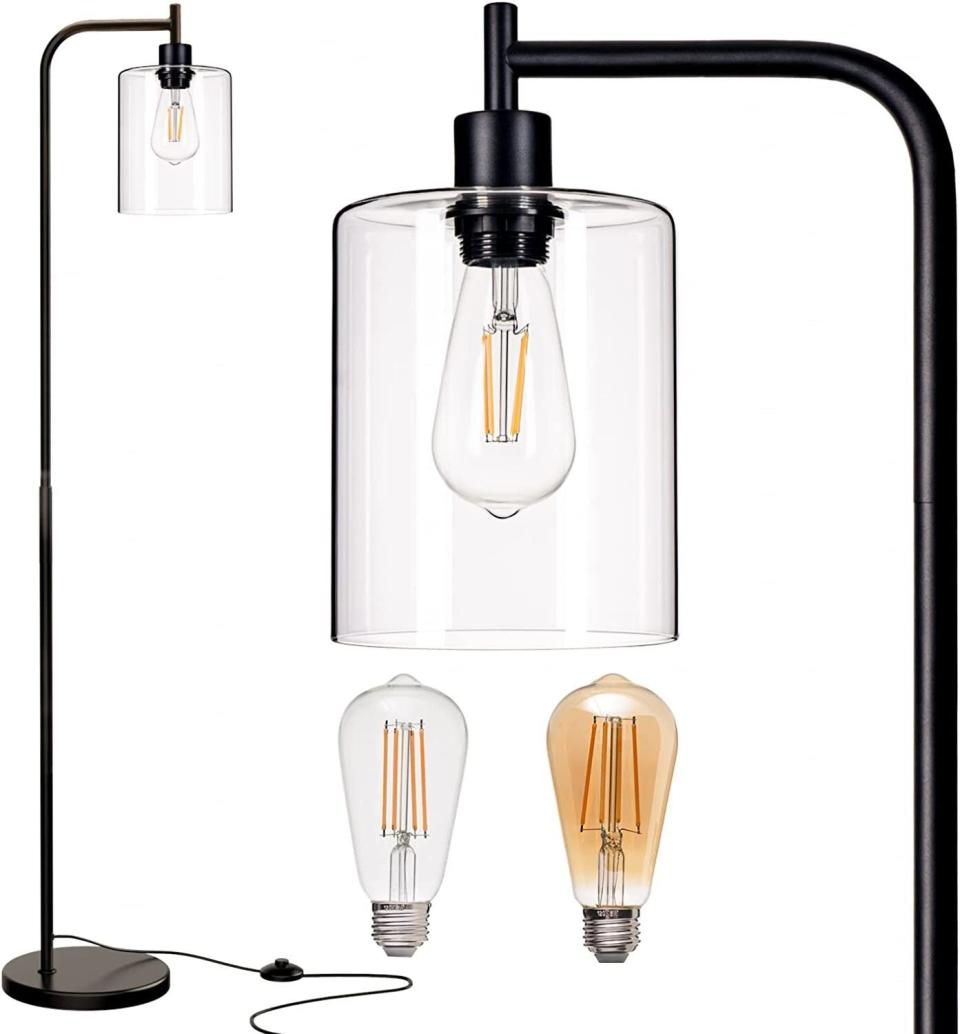 <div><p>"Layered lighting can also help, so think beyond the desk lamp," Gage said. "Get yourself a nice floor lamp and overhead fixture to bring more light into the room."This hanging glass shade floor lamp comes with two styles of lightbulbs and has an easy-access switch you can simply step on. </p><p><i>You can buy the <a href="https://www.amazon.com/addlon-Hanging-Distinctive-Standing-Industrial/dp/B09D2VR3S3" rel="nofollow noopener" target="_blank" data-ylk="slk:LED floor lamp with a glass shade;elm:context_link;itc:0;sec:content-canvas" class="link ">LED floor lamp with a glass shade</a> from Amazon for around $50-$60. </i></p></div><span> Amazon</span>