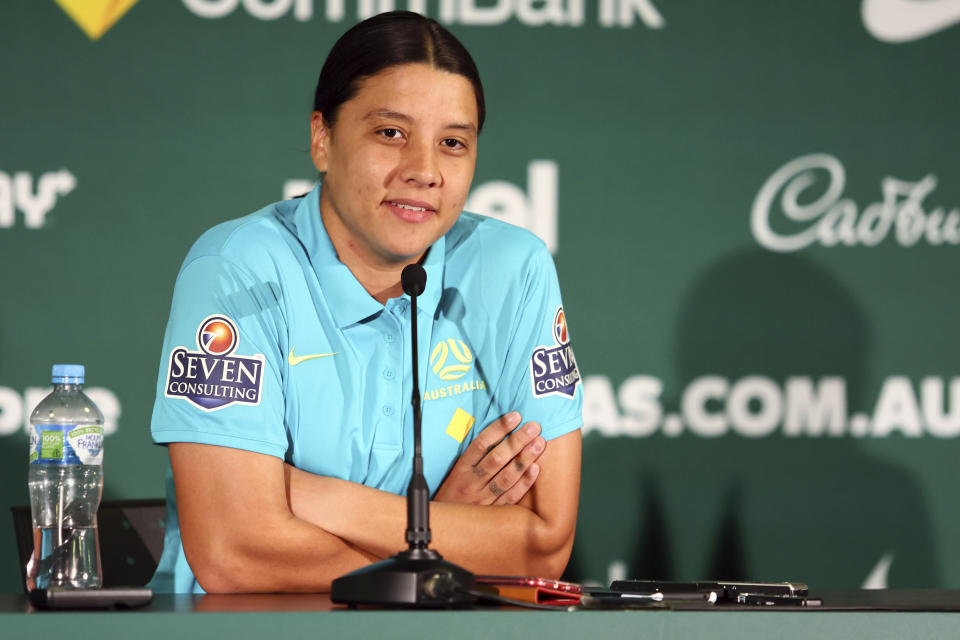 Australia's Women's World Cup captain Sam Kerr reacts during a press conference in Brisbane, Australia, Saturday, July 29, 2023. Kerr says she'll be available for Australia's must-win Women's World Cup game against Olympic champion Canada after missing the team's first two group games because of a calf muscle injury. (AP Photo/Tertius Pickard)