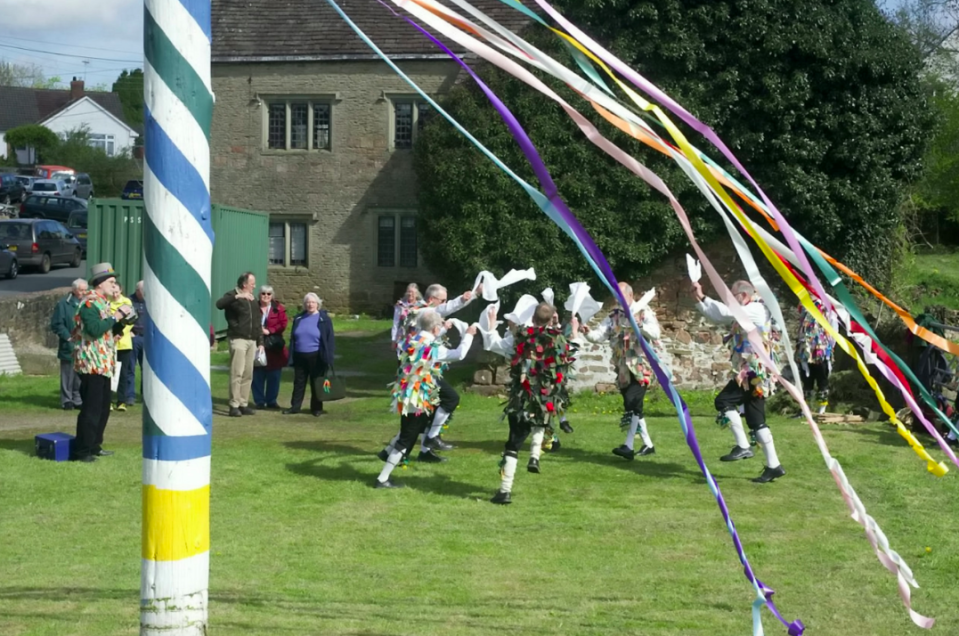 <em>Villagers held a ‘dance of defiance’ in protest around the 50ft high maypole (SWNS)</em>