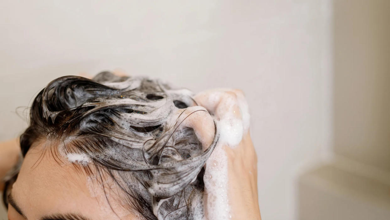 A person washing their hair