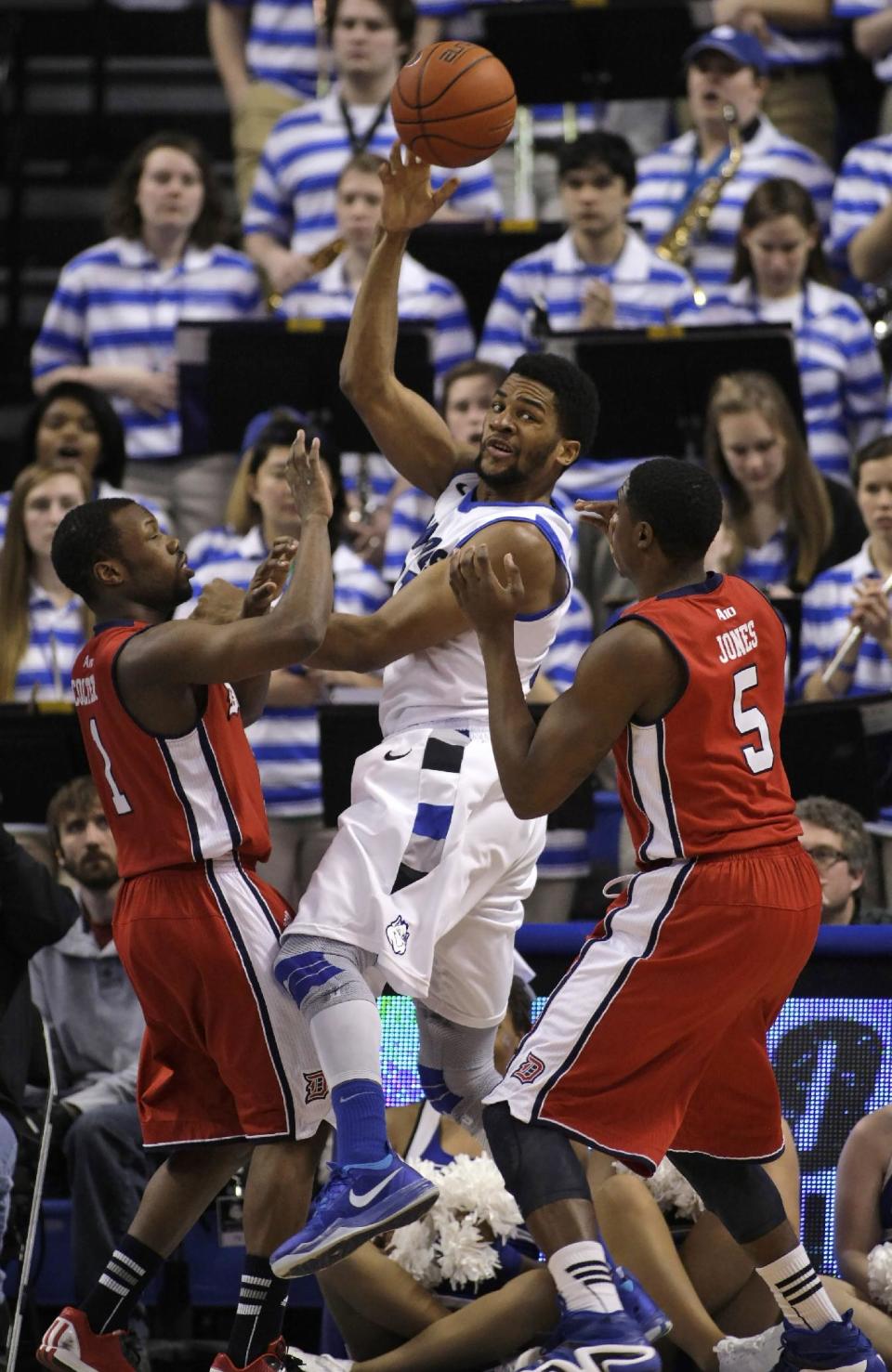 Saint Louis' Dwayne Evans (21) passes out of the double-team by Duquesne's Derrick Colter (1) and Jerry Jones (5) during the first half of an NCAA college basketball game, Thursday, Feb. 27, 2014, in St. Louis. (AP Photo/Tom Gannam)