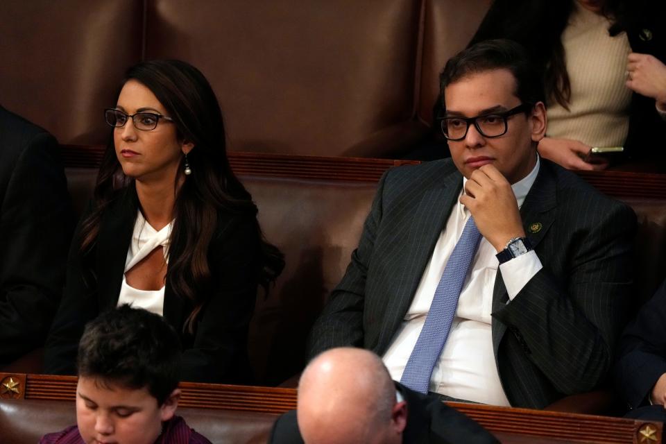 Rep. Lauren Boebert, R-Colo., and Rep. George Santos, R-NY, sit in the House chamber.