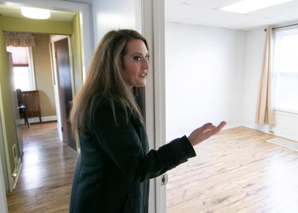 Attorney Theresa Jenkins, shown Thursday, Dec. 2, 2021, walks through the historic Brighton building that will serve as offices and emergency respite for children who are removed from custody situations and are awaiting placement.