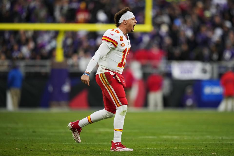 Kansas City Chiefs quarterback Patrick Mahomes (15) reacts after a touchdown by Kansas City Chiefs running back Isiah Pacheco during the first half of the AFC Championship NFL football game against the Baltimore Ravens, Sunday, Jan. 28, 2024, in Baltimore. (AP Photo/Matt Slocum)