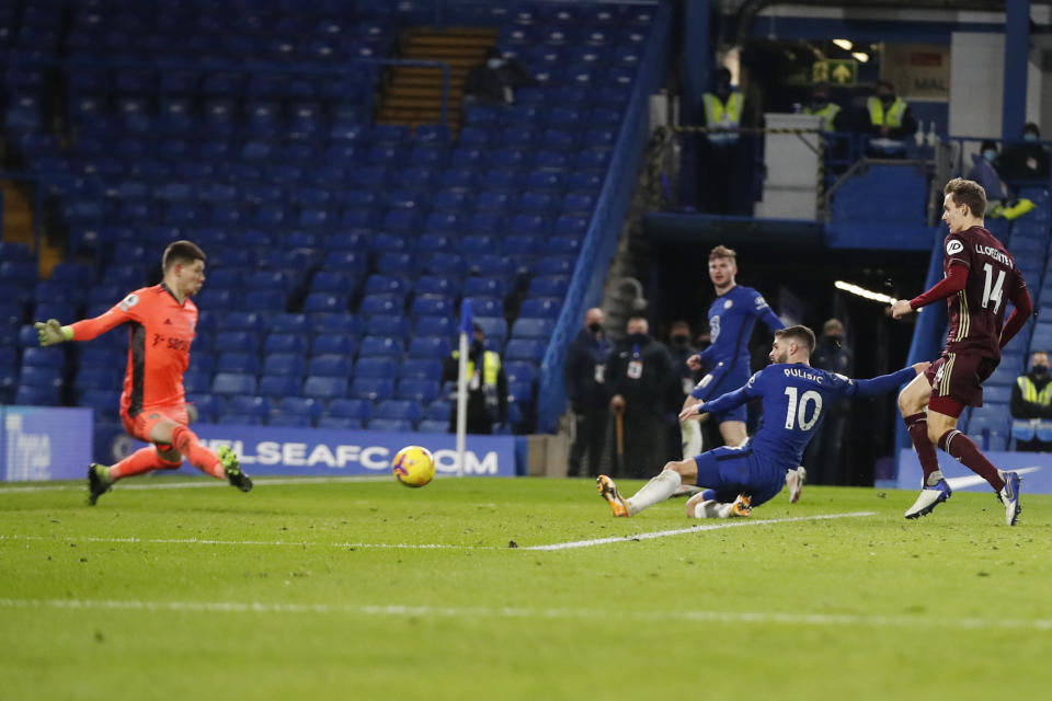 Chelsea's Christian Pulisic, center right, scores his side's third goal past Leeds United's goalkeeper Illan Meslier, left, during the English Premier League soccer match between between Chelsea and Leeds United at Stamford Bridge in London, England, Saturday, Dec. 5, 2020. (Matthew Childs/Pool via AP)