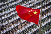 Students attend a ceremony to kick off the new semester in Wuhan High School in Wuhan in central China's Hubei province Tuesday, Sept. 1, 2020. Chinese students began a full return to regular classes Tuesday following two weeks without new cases of local transmission in the country. (Chinatopix Via AP)