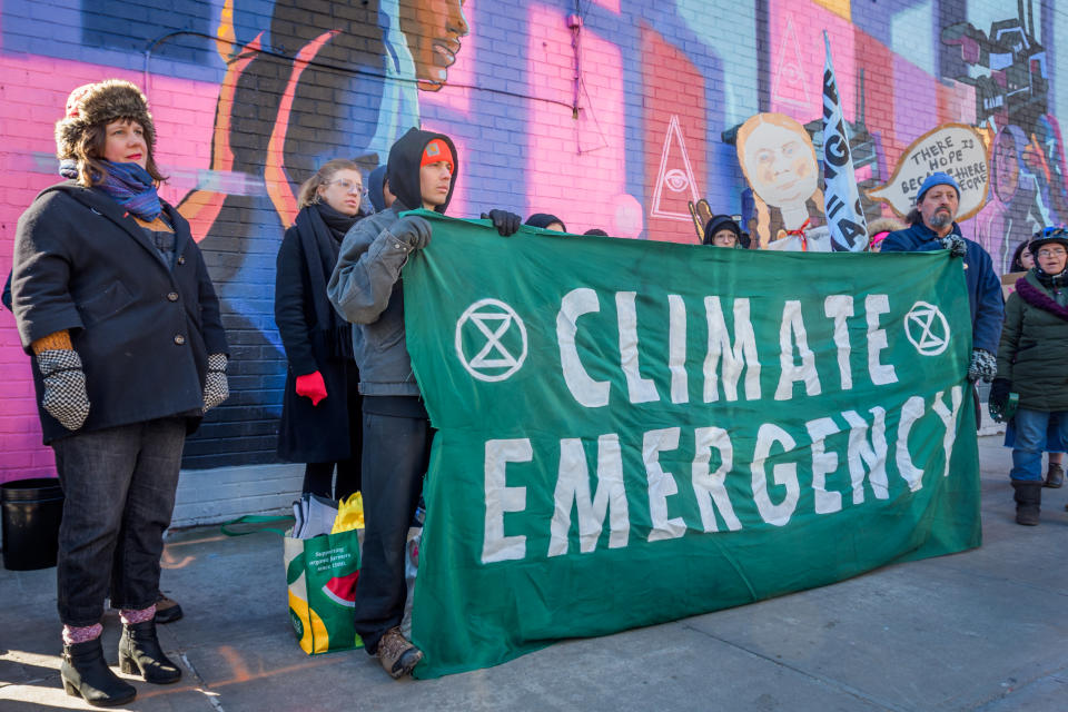 BROOKLYN, NY, UNITED STATES - 2020/02/29: Protesters holding a Climate Emergency banner. Community members from across North Brooklyn joined climate activist group Extinction Rebellion NYC at a rally on Manhattan Avenue and Moore Street near the construction site of National Grids controversial Metropolitan Reliability Infrastructure (MRI) project shutting down again construction for the day. Community calls for immediate, permanent halt of construction and on Mayor De Blasio, and Governor Cuomo to oppose project. (Photo by Erik McGregor/LightRocket via Getty Images)