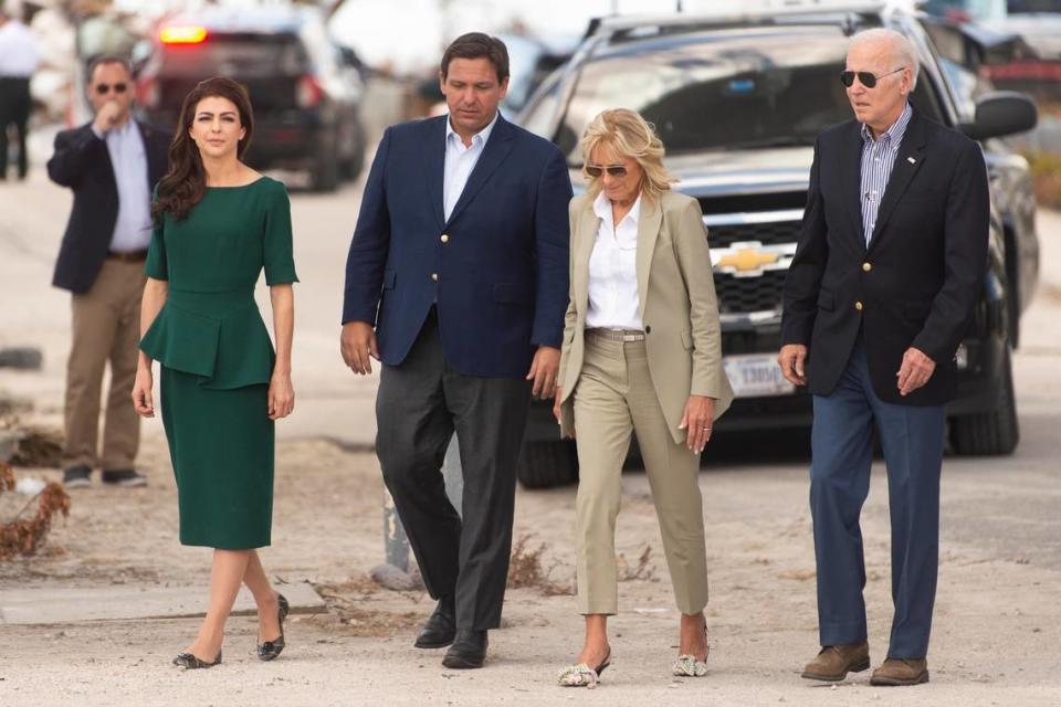 From left, Florida’s first lady Casey DeSantis, Gov. Ron DeSantis, first lady Jill Biden and President Joe Biden arrive at Fort Myers Beach, Fla., Wednesday, Oct. 5, 2022, to survey the damage caused by Hurricane Ian.