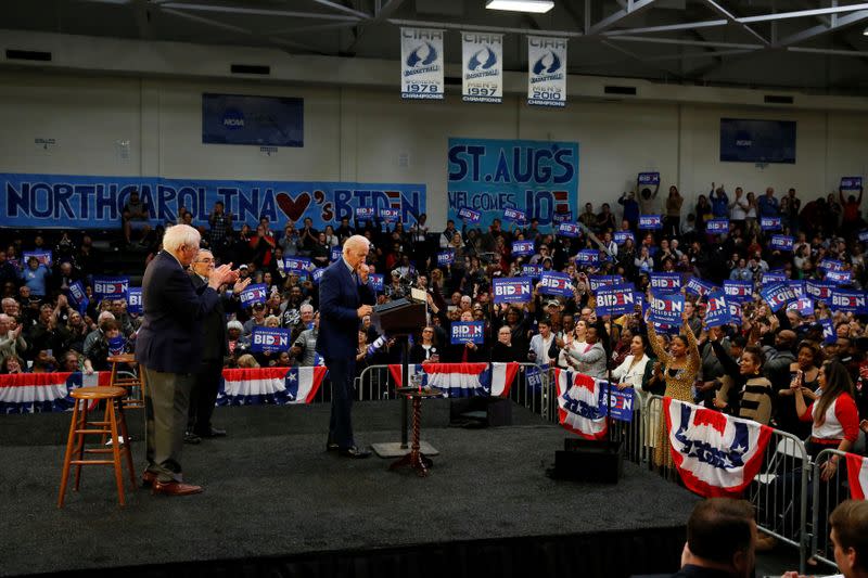 Democratic U.S. presidential candidate and former U.S. Vice President Joe Biden coughs at the end of a campaign event at Saint Augustine's University in Raleigh