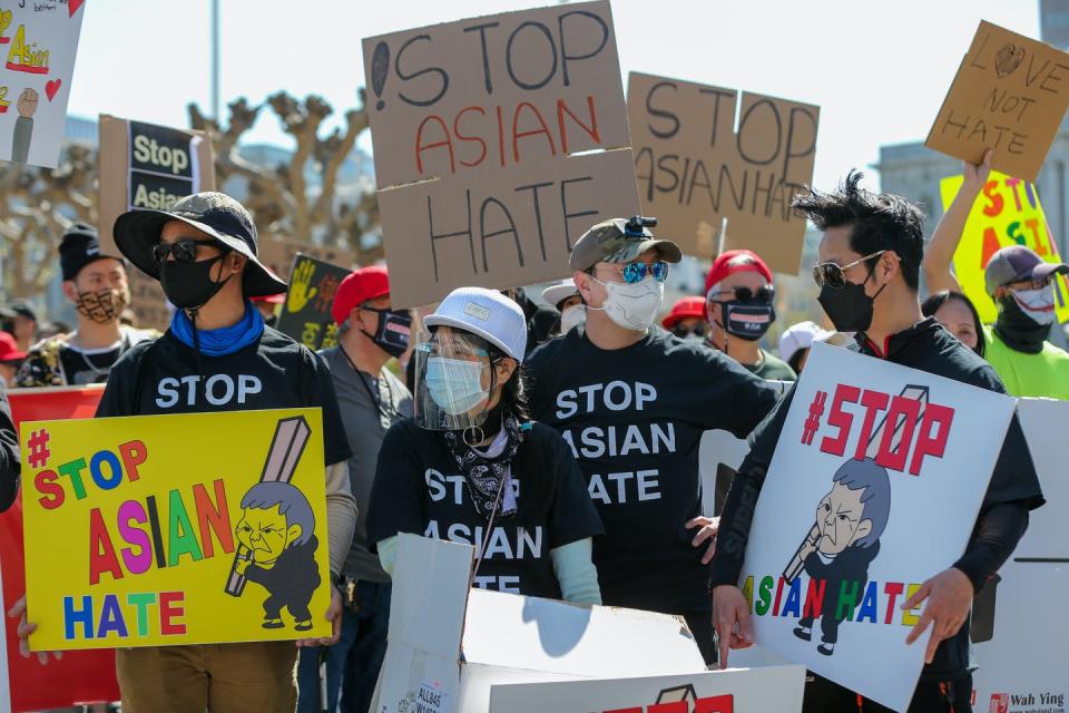 Demonstrators listen to speakers during a march protesting Asian hate crimes and actions in San Francisco in March 2021. <a href="https://media.gettyimages.com/photos/william-guo-left-francis-kwok-henry-lei-right-all-of-alameda-and-a-picture-id1309485284?s=2048x2048" rel="nofollow noopener" target="_blank" data-ylk="slk:Ray Chavez/MediaNews Group/The Mercury News via Getty Images;elm:context_link;itc:0;sec:content-canvas" class="link ">Ray Chavez/MediaNews Group/The Mercury News via Getty Images</a>