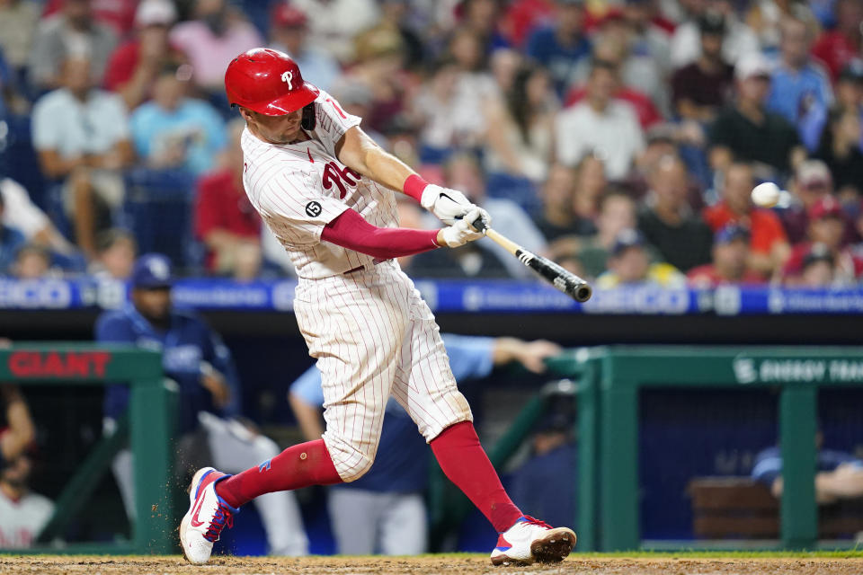 Philadelphia Phillies' Rhys Hoskins hits a home run off Tampa Bay Rays pitcher Collin McHugh during the eighth inning of an interleague baseball game, Wednesday, Aug. 25, 2021, in Philadelphia. (AP Photo/Matt Slocum)