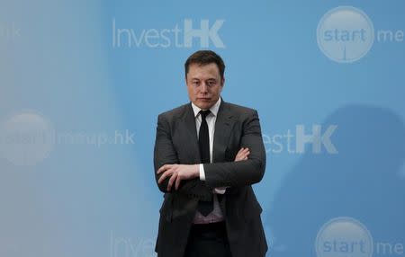 Tesla Chief Executive Elon Musk stands on the podium as he attends a forum on startups in Hong Kong, China in this January 26, 2016, file photo. REUTERS/Bobby Yip/Files